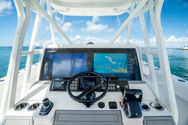 Slide: The Image of 2024 SeaVee 400Z boat cockpit with advanced navigation screens and controls. - 3