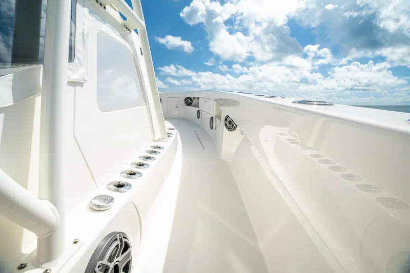 Slide: The Image of 2024 SeaVee 400Z boat deck with sleek design under a bright blue sky. - 5