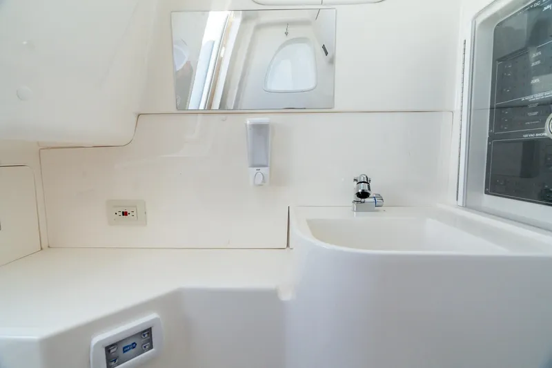 Slide: The Image of 2024 SeaVee 400Z interior with sink, mirror, and control panel. - 9