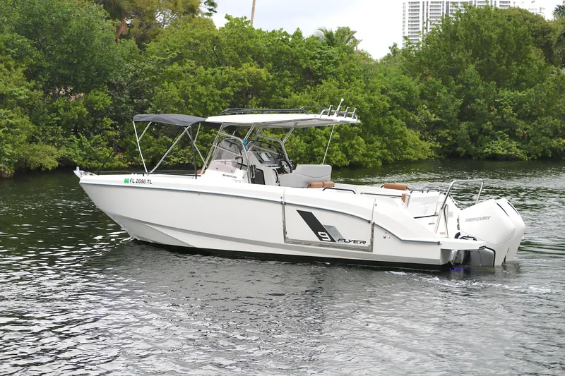 The Image of 2022 Beneteau Flyer 9 SPACEdeck boat cruising on a calm river. - 0