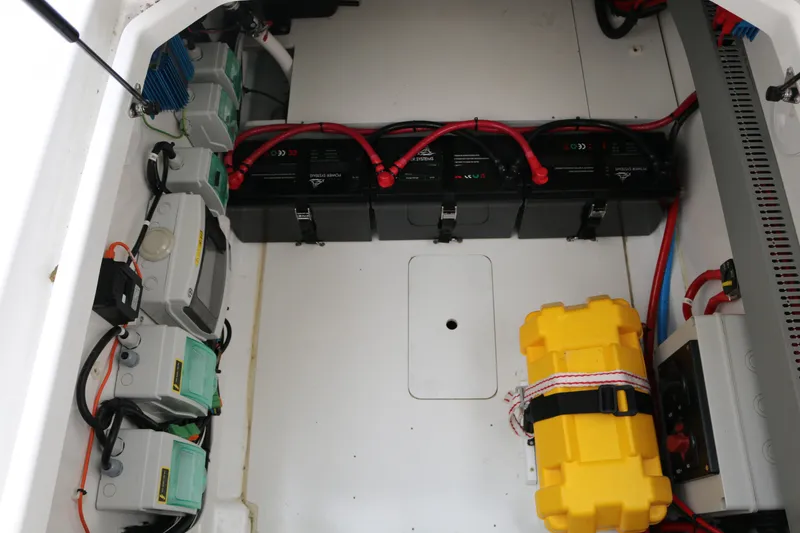 Slide: The Image of Electrical compartment of 2022 Beneteau Flyer 9 SPACEdeck with batteries and wiring. - 16