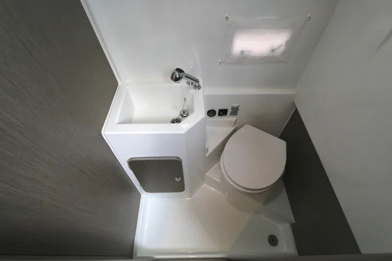 Slide: The Image of Compact bathroom in 2022 Beneteau Flyer 9 SPACEdeck with sink and toilet. - 6