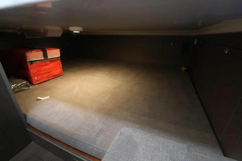 Slide: The Image of Interior cabin of 2022 Beneteau Flyer 9 SPACEdeck with storage and red bag. - 7