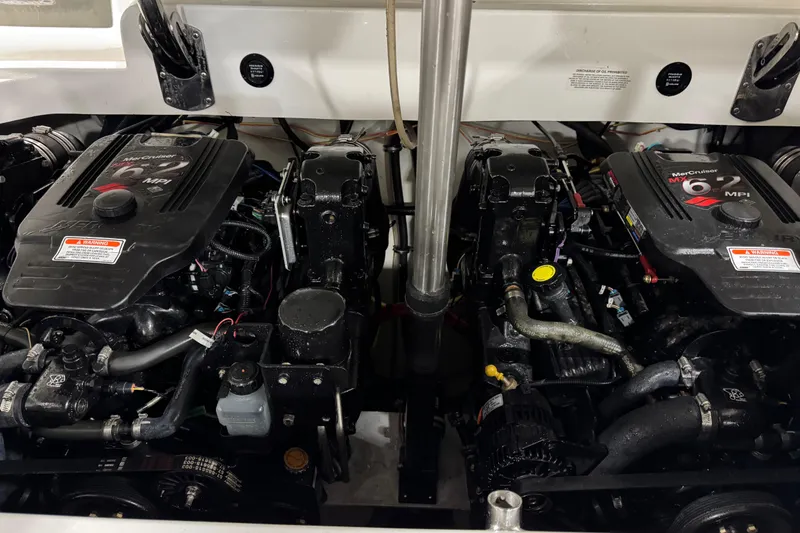 Slide: The Image of Twin MerCruiser engines in a 2007 Cobalt 302 boat engine compartment. - 12