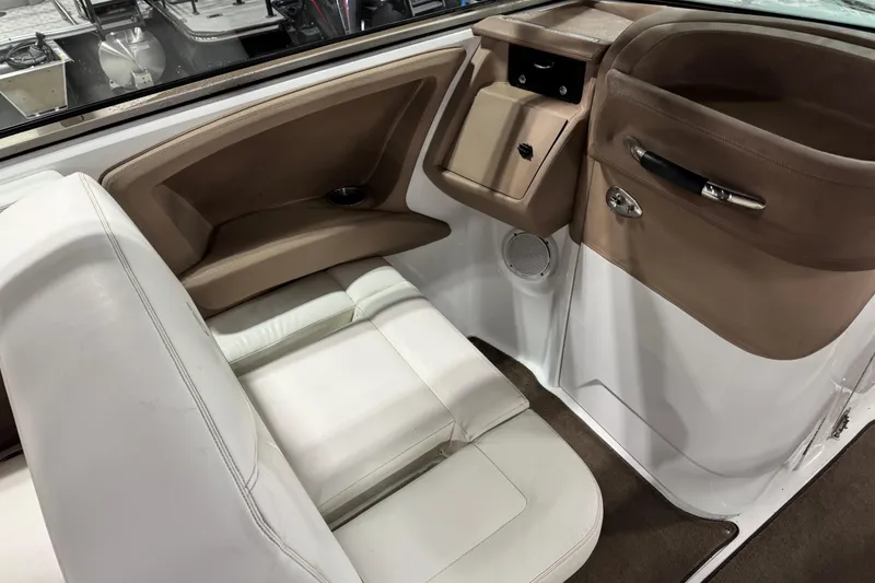 Slide: The Image of Interior of a 2007 Cobalt 302 boat with white and tan seating. - 8