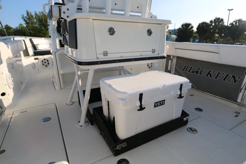 Slide: The Image of 2021 BLACWATER 252CC boat interior with YETI cooler and Blackfin branding. - 12