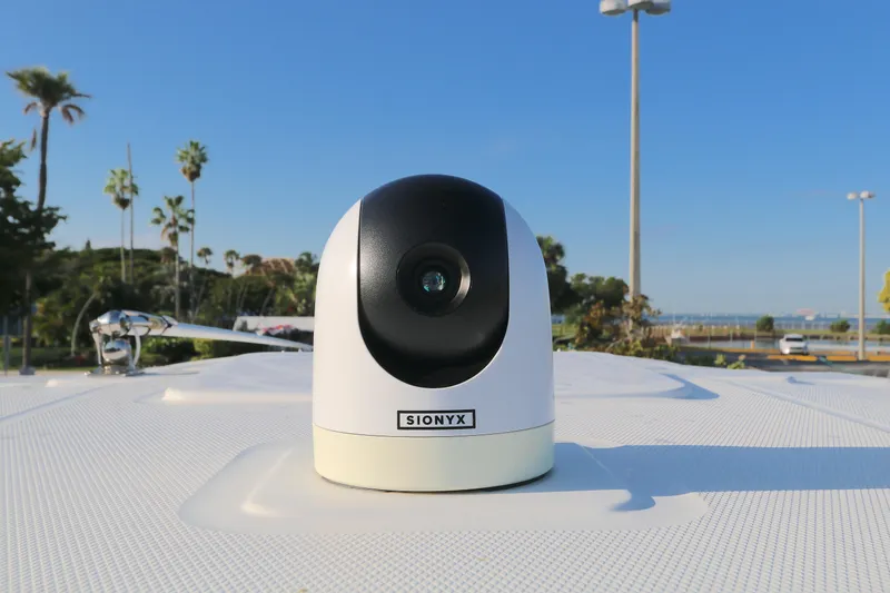 Slide: The Image of Outdoor security camera on a BLACWATER 252CC boat, 2021 model, with a clear blue sky. - 15