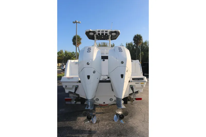 Slide: The Image of 2021 BLACWATER 252CC boat with dual outboard engines, rear view. - 17
