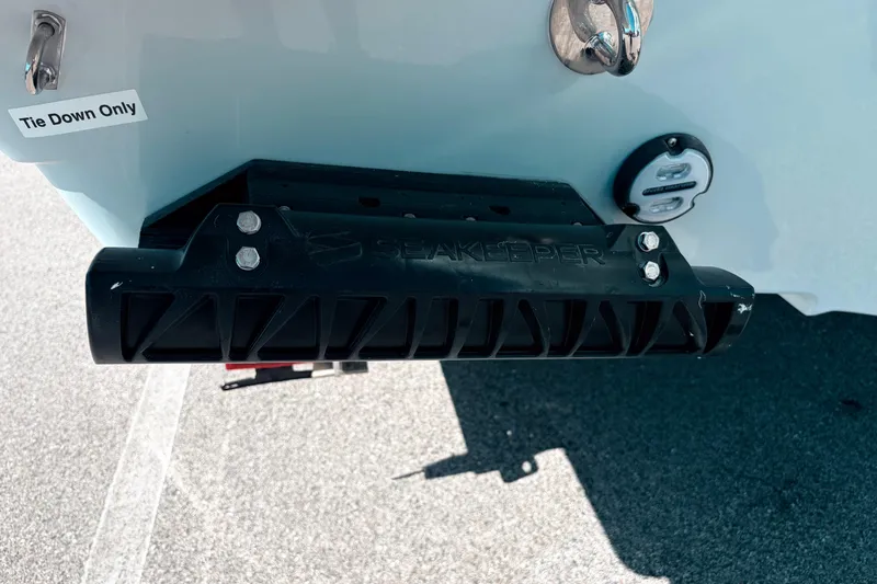 Slide: The Image of 2026 Sailfish 252 CC boat stern with Seakeeper stabilizer and tie-down point. - 10