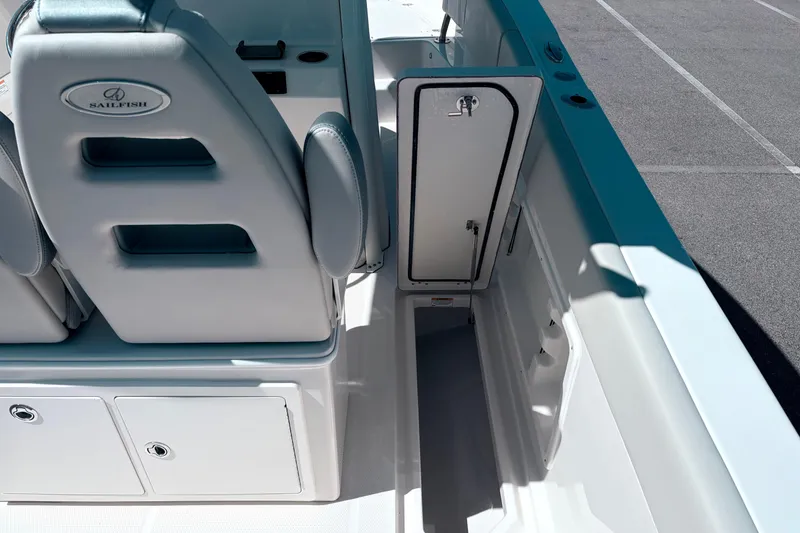 Slide: The Image of 2026 Sailfish 252 CC boat interior with storage compartments and seating. - 12