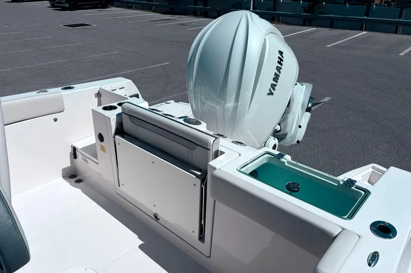 Slide: The Image of 2026 Sailfish 252 CC boat with Yamaha engine in a parking lot. - 15