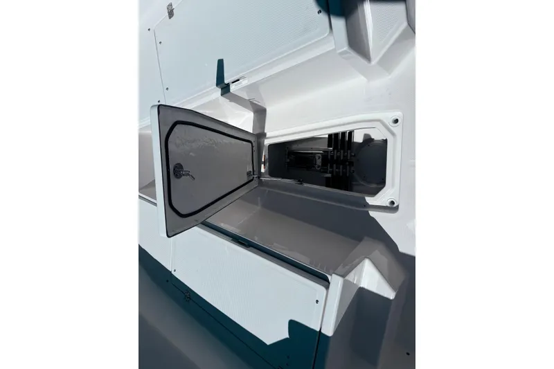 Slide: The Image of Open storage compartment on 2026 Sailfish 252 CC boat, showcasing interior design. - 18