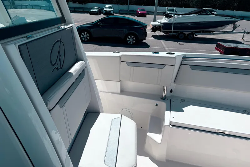 Slide: The Image of Interior view of 2026 Sailfish 252 CC boat, showcasing seating and deck details. - 19