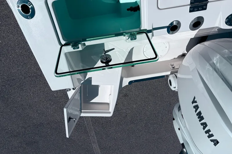 Slide: The Image of 2026 Sailfish 252 CC boat with Yamaha engine and open storage compartments. - 22