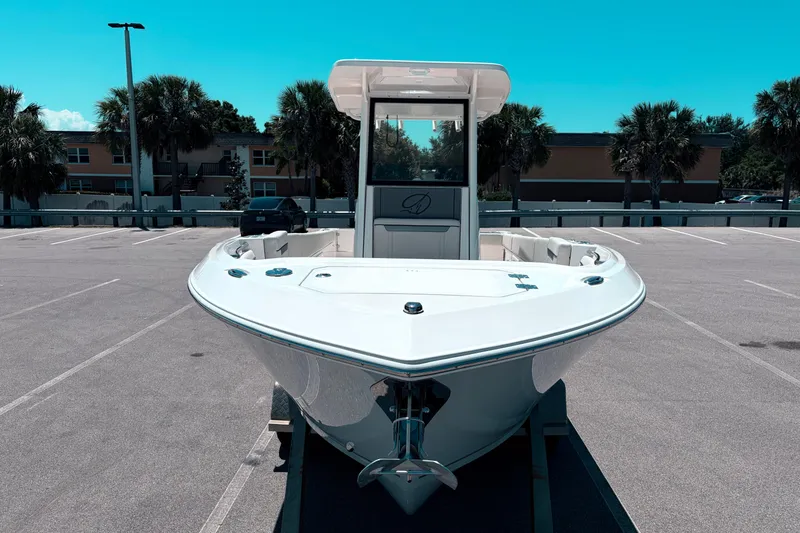 Slide: The Image of 2026 Sailfish 252 CC boat in parking lot, front view, clear sky background. - 3