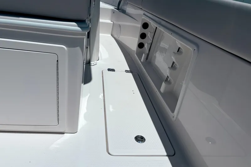 Slide: The Image of 2026 Sailfish 252 CC boat interior with storage compartments and seating. - 32