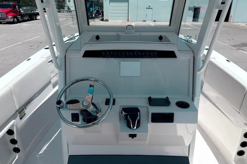 Slide: The Image of 2026 Sailfish 252 CC boat cockpit with steering wheel and control panel. - 33