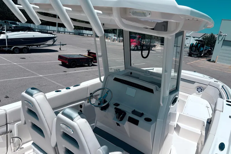 Slide: The Image of 2026 Sailfish 252 CC boat interior with dual seats and steering console. - 34