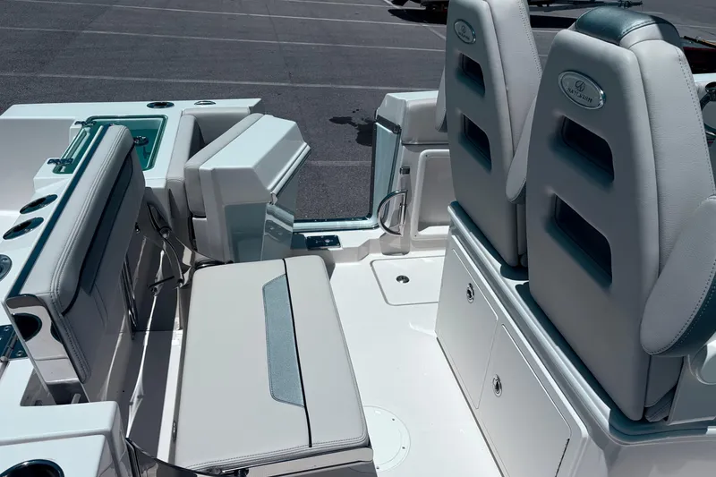 Slide: The Image of 2026 Sailfish 252 CC boat interior with cushioned seating and storage compartments. - 35