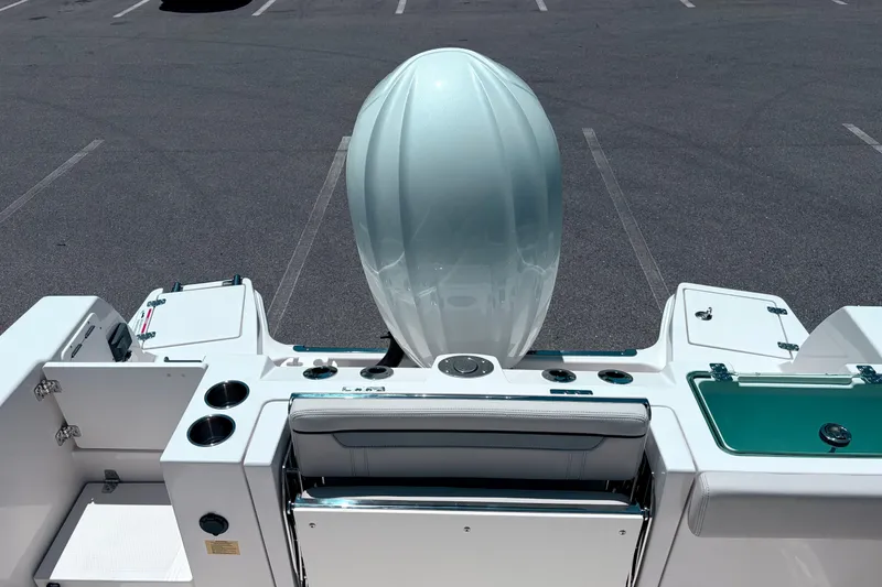Slide: The Image of 2026 Sailfish 252 CC boat stern view with engine and seating area. - 36