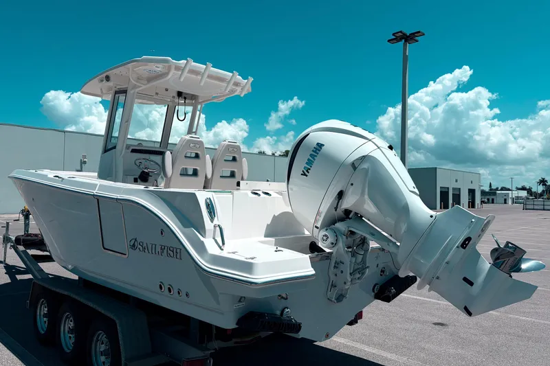 Slide: The Image of 2026 Sailfish 252 CC boat with Yamaha engine on trailer under blue sky. - 4