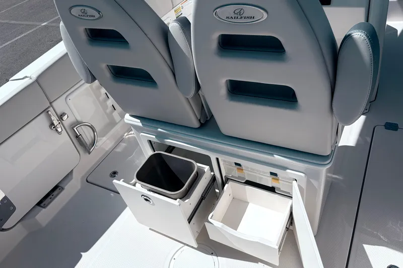 Slide: The Image of 2026 Sailfish 252 CC boat interior with storage compartments and seating. - 8