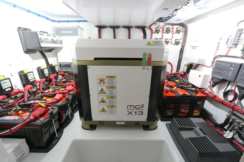 Slide: The Image of Engine room of 2021 Yellowfin 54 Offshore with batteries and Quick Gyro X13 stabilizer. - 23