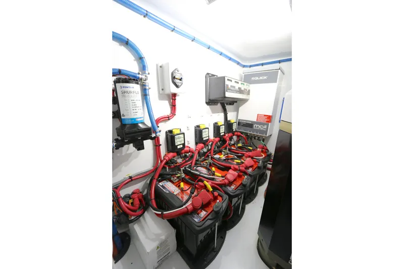 Slide: The Image of Electrical system of a 2021 Yellowfin 54 Offshore boat, featuring batteries and wiring. - 24