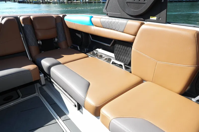 Slide: The Image of Luxurious interior seating of a 2020 Malibu M240 boat with tan and gray upholstery. - 13