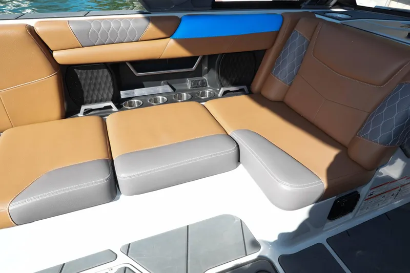 Slide: The Image of Luxurious seating in 2020 Malibu M240 boat with tan and gray upholstery. - 14