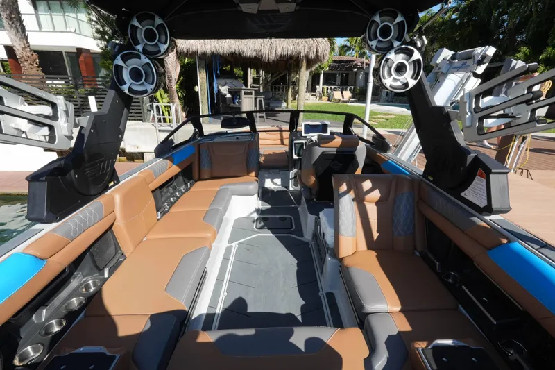 Slide: The Image of 2020 Malibu M240 boat interior with luxurious seating and advanced audio system. - 25