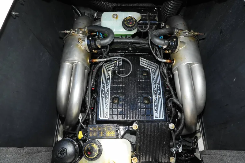 Slide: The Image of Engine compartment of a 2020 Malibu M240 boat with supercharged components. - 37