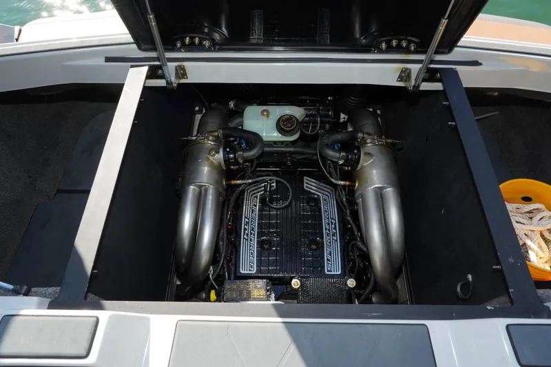 Slide: The Image of Open engine compartment of a 2020 Malibu M240 boat, showcasing the supercharged engine. - 39