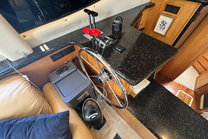 Slide: The Image of Interior of 2001 Carver 356 Motor Yacht with steering wheel and dashboard. - 11