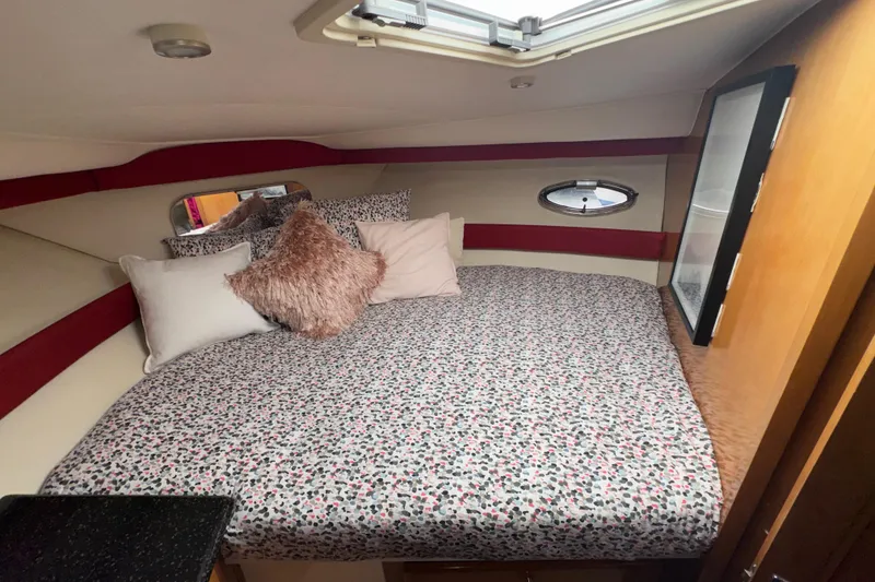 Slide: The Image of Cozy bedroom in 2001 Carver 356 Motor Yacht with patterned bedding and plush pillows. - 17