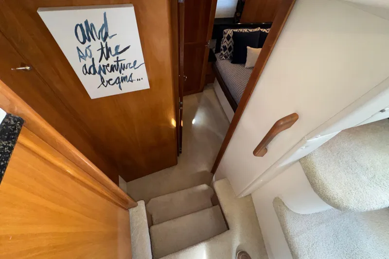 Slide: The Image of Interior of 2001 Carver 356 Motor Yacht with stairs and cozy bedroom. - 20