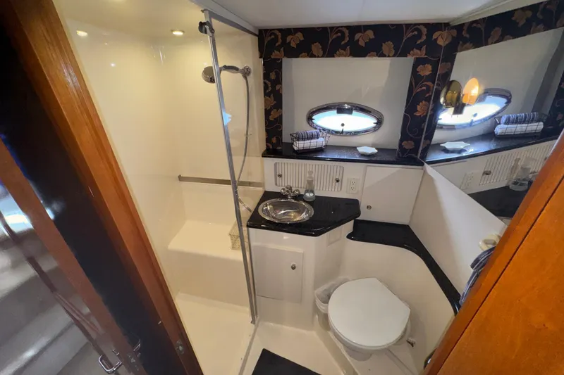 Slide: The Image of Bathroom interior of 2001 Carver 356 Motor Yacht with shower, sink, and toilet. - 23