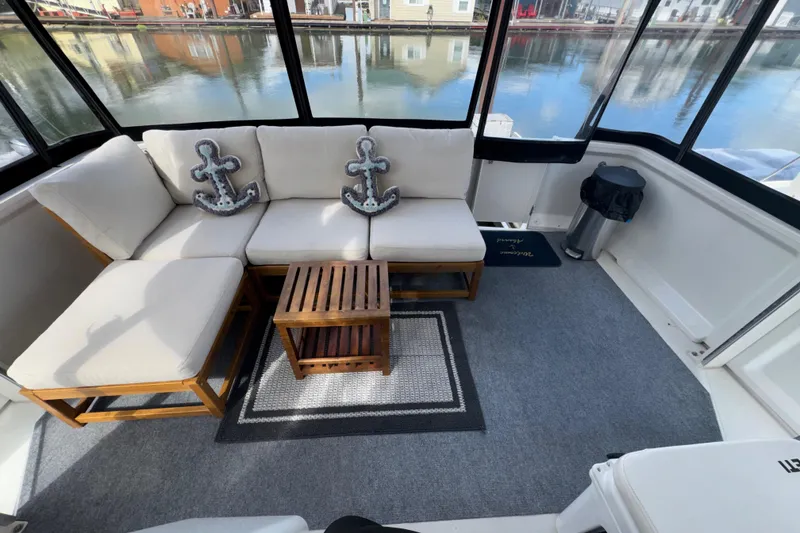 Slide: The Image of Luxurious 2001 Carver 356 Motor Yacht interior with cozy seating and nautical decor. - 24