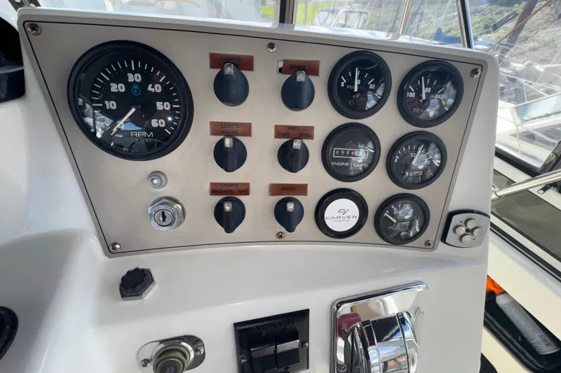 Slide: The Image of Control panel of a 2001 Carver 356 Motor Yacht with gauges and switches. - 31