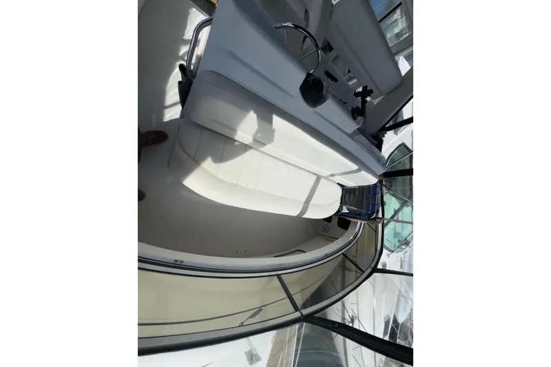 Slide: The Image of Interior view of 2001 Carver 356 Motor Yacht with white seating and steering area. - 34