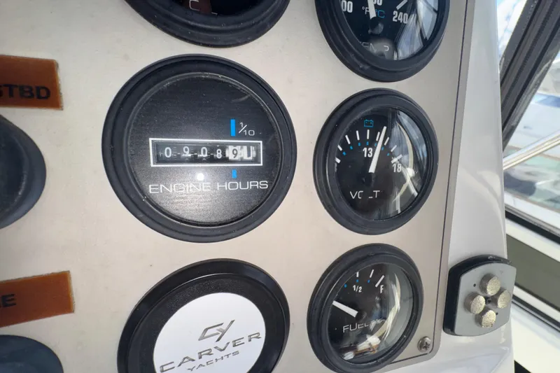 Slide: The Image of Close-up of 2001 Carver 356 Motor Yacht dashboard gauges displaying engine hours and fuel levels. - 35