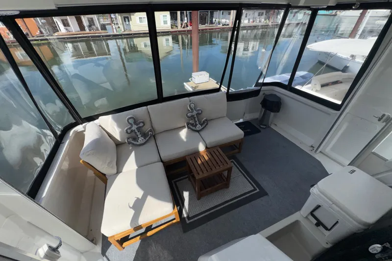 Slide: The Image of Spacious interior of 2001 Carver 356 Motor Yacht with cozy seating and nautical decor. - 36