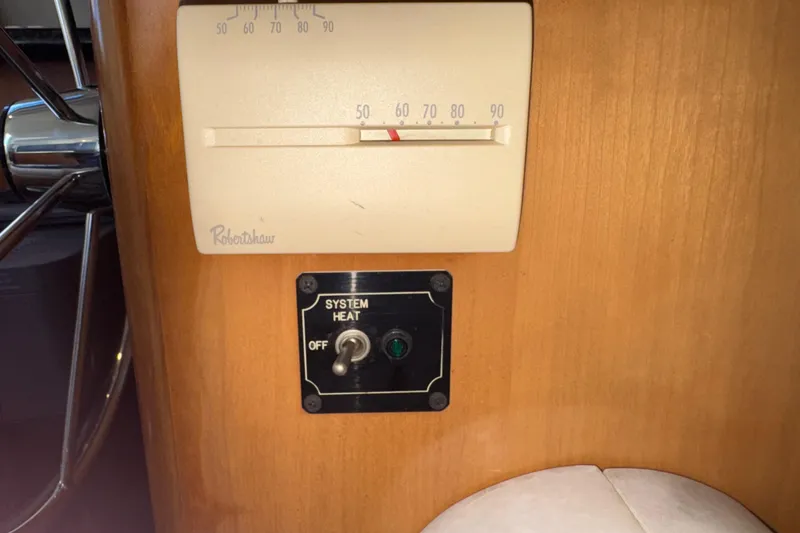Slide: The Image of Thermostat and heat control switch on 2001 Carver 356 Motor Yacht interior panel. - 40