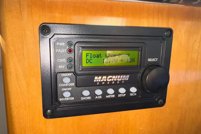 Slide: The Image of Magnum Energy control panel on 2001 Carver 356 Motor Yacht, displaying float charging status. - 42