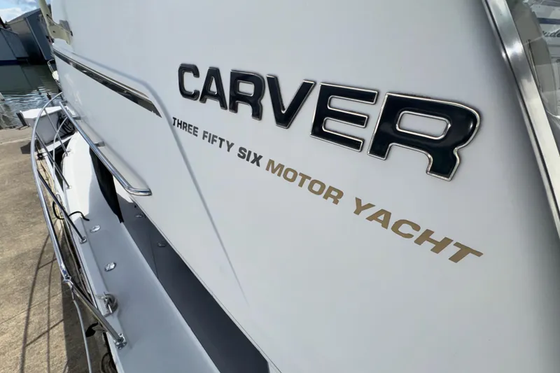 Slide: The Image of 2001 Carver 356 Motor Yacht, docked, showcasing sleek design and branding. - 45