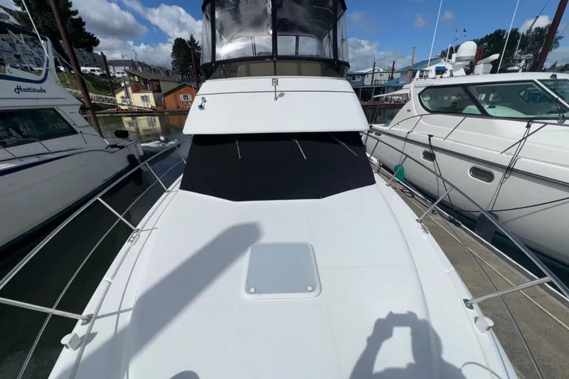 Slide: The Image of 2001 Carver 356 Motor Yacht docked at marina, sunny day, clear sky. - 48