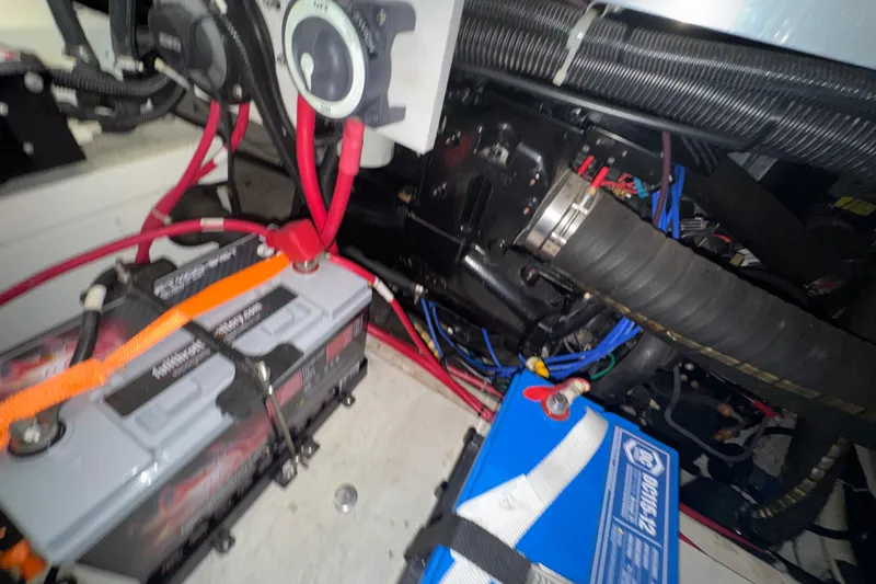 Slide: The Image of Engine compartment of a 2001 Carver 356 Motor Yacht with batteries and wiring. - 54