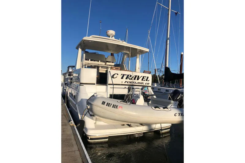 Slide: The Image of 2001 Carver 356 Motor Yacht docked with inflatable boat, Portland, Oregon. - 59