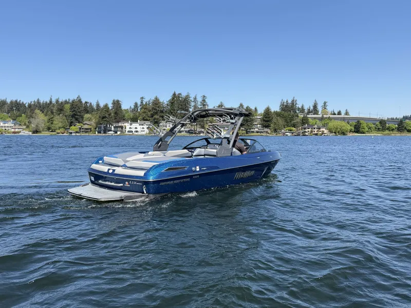 Slide: The Image of 2017 Malibu Wakesetter 23 LSV on a serene lake. - 10