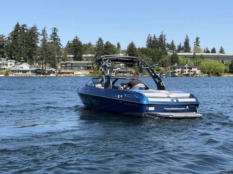 Slide: The Image of 2017 Malibu Wakesetter 23 LSV on a serene lake. - 11
